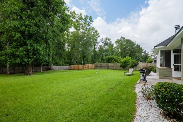5080 Carlton Ridge Cir, Hahira, GA 31632 - fenced backyard featuring a sunroom and a patio area