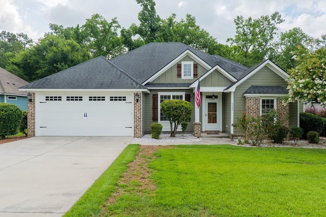 5080 Carlton Ridge Cir, Hahira, GA 31632 - craftsman inspired home with a garage, a front lawn, board and batten siding, driveway, and brick siding