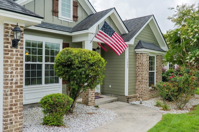 5080 Carlton Ridge Cir, Hahira, GA 31632 - doorway to property featuring a shingled roof and board and batten siding