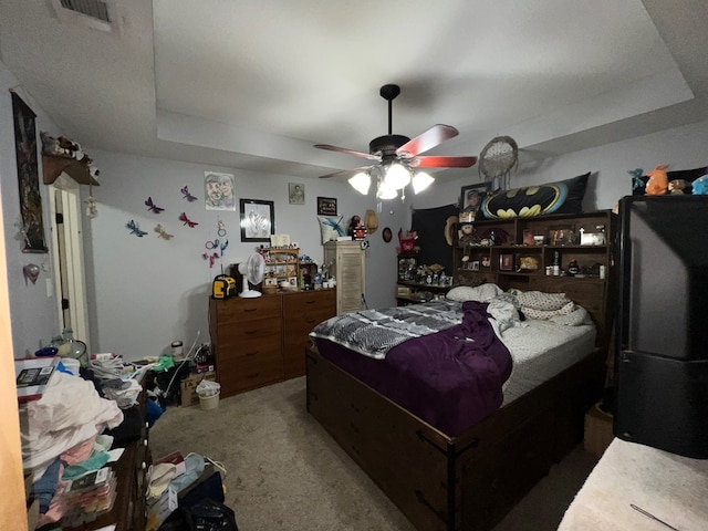 5612 Emily Ln, Hahira, GA 31632 - bedroom with carpet floors, a tray ceiling, and ceiling fan