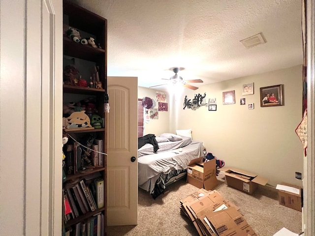 5612 Emily Ln, Hahira, GA 31632 - carpeted bedroom with a textured ceiling and a ceiling fan
