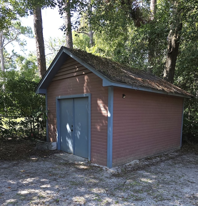 garage featuring a storage unit