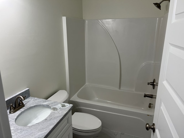 full bathroom featuring washtub / shower combination, vanity, and toilet