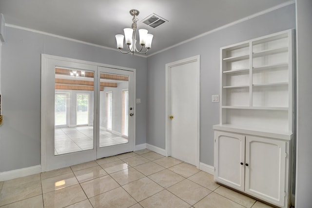 2321 Frederick Pl, Valdosta, GA 31602 - unfurnished dining area featuring a chandelier, ornamental molding, and light tile patterned floors