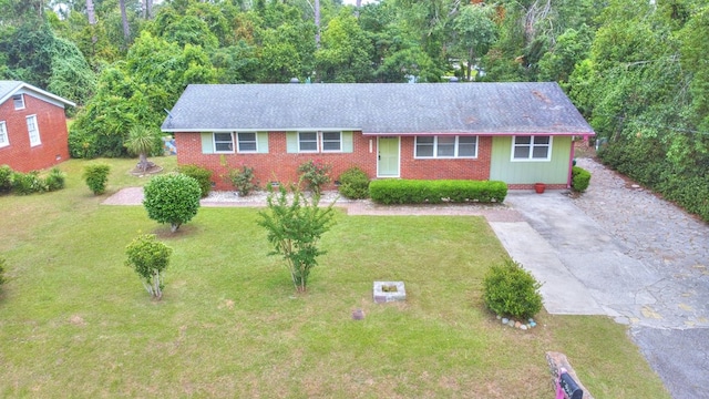 2321 Frederick Pl, Valdosta, GA 31602 - single story home with driveway, a front yard, brick siding, and a shingled roof
