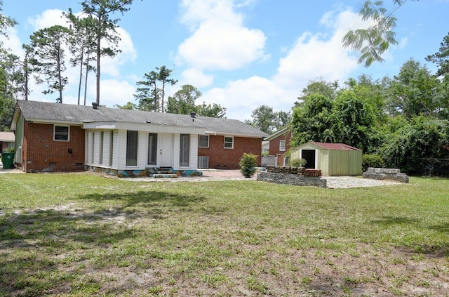 2321 Frederick Pl, Valdosta, GA 31602 - rear view of property featuring brick siding, crawl space, and a yard
