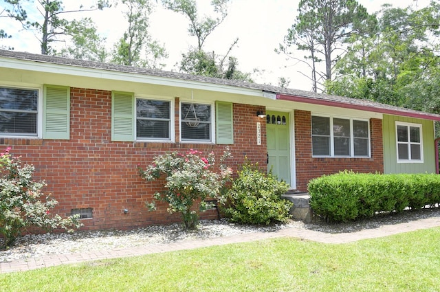 2321 Frederick Pl, Valdosta, GA 31602 - ranch-style home with brick siding, a front lawn, and crawl space