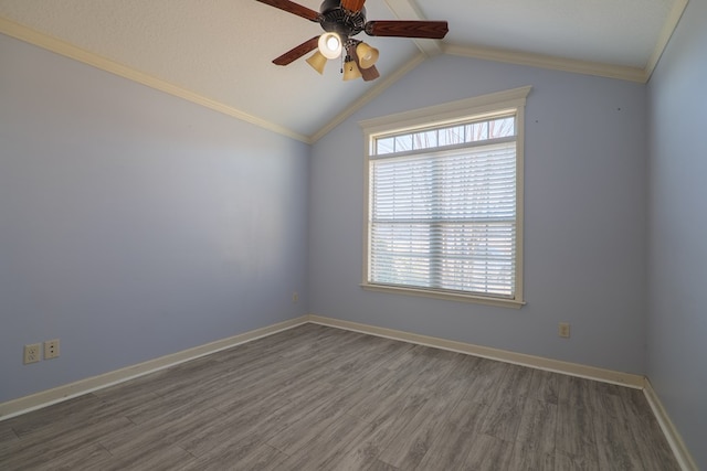 unfurnished room with crown molding, ceiling fan, lofted ceiling, and dark hardwood / wood-style flooring