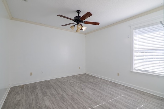 unfurnished room featuring crown molding, ceiling fan, a textured ceiling, and light wood-type flooring