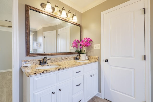 bathroom featuring vanity and ornamental molding