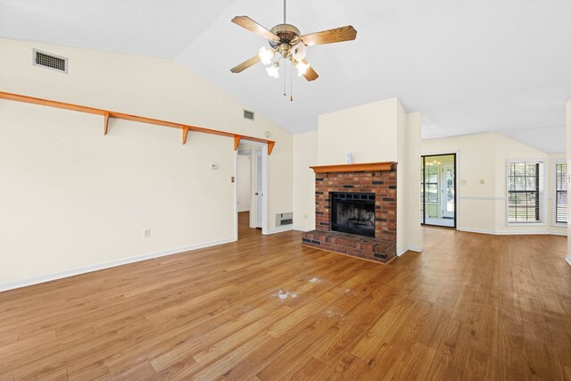 4312 Shiloh Trce, Valdosta, GA 31602 - unfurnished living room featuring lofted ceiling, a ceiling fan, light wood-type flooring, a fireplace, and baseboards