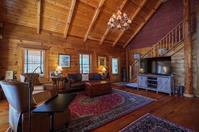 living room with beam ceiling, hardwood / wood-style floors, high vaulted ceiling, and wooden ceiling