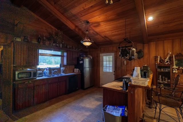 kitchen featuring sink, vaulted ceiling with beams, a notable chandelier, wood ceiling, and appliances with stainless steel finishes