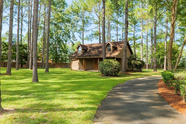 cape cod house with a front lawn