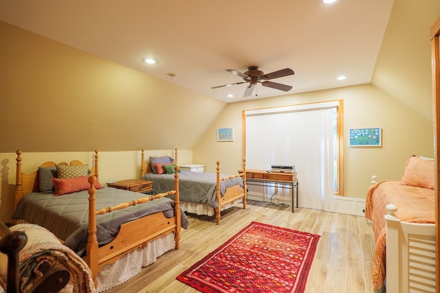 bedroom featuring vaulted ceiling, light hardwood / wood-style flooring, and ceiling fan