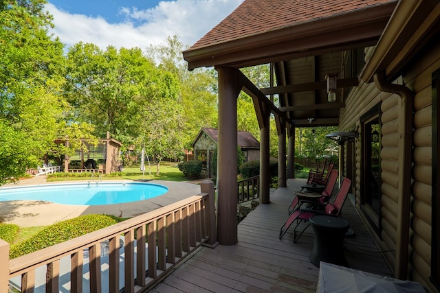 view of swimming pool featuring a wooden deck