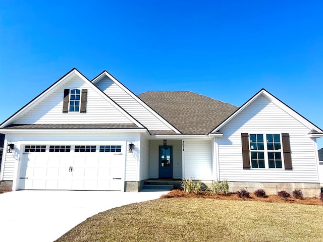 view of front facade featuring an attached garage, roof with shingles, concrete driveway, and a front lawn