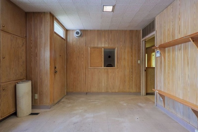 1614 N Patterson St, Valdosta, GA 31602 - interior space featuring wooden walls, visible vents, and light floors