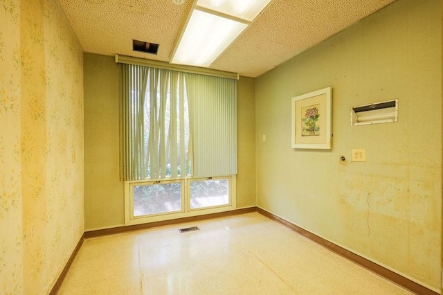 1614 N Patterson St, Valdosta, GA 31602 - empty room with a wealth of natural light, visible vents, and baseboards