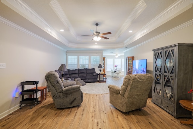 4137 Nelson Hill Pl, Hahira, GA 31632 - living room with a ceiling fan, wood finished floors, a tray ceiling, and ornamental molding