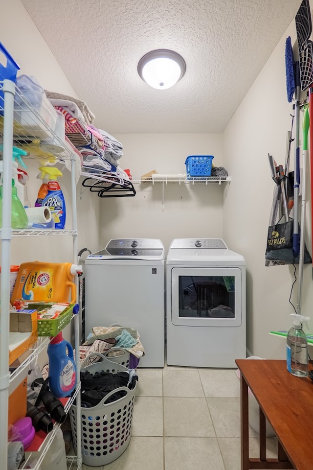 4137 Nelson Hill Pl, Hahira, GA 31632 - washroom featuring washer and clothes dryer, a textured ceiling, and tile patterned floors