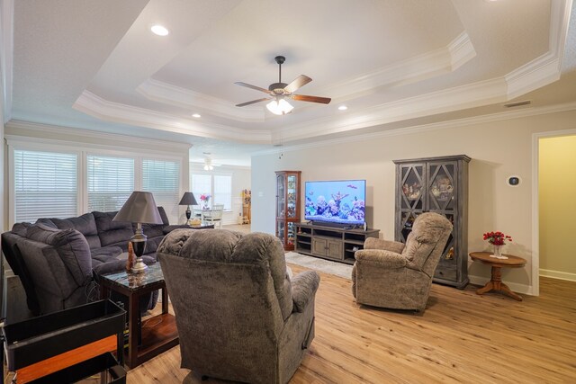 4137 Nelson Hill Pl, Hahira, GA 31632 - living area with a raised ceiling, a ceiling fan, light wood-type flooring, and ornamental molding