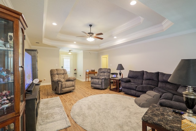 4137 Nelson Hill Pl, Hahira, GA 31632 - living room featuring a tray ceiling, a ceiling fan, wood finished floors, crown molding, and recessed lighting
