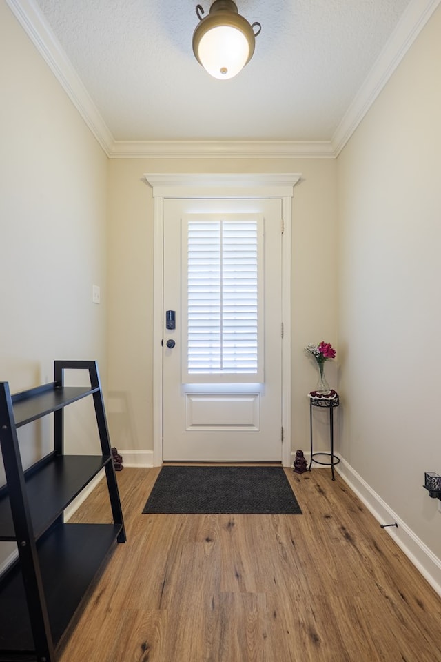 4137 Nelson Hill Pl, Hahira, GA 31632 - doorway to outside with ornamental molding, wood finished floors, and a textured ceiling