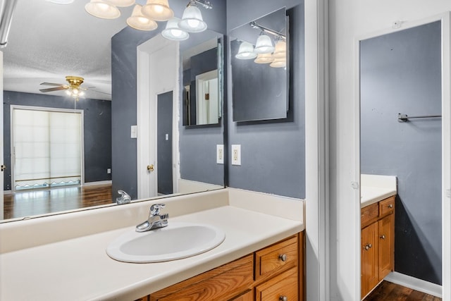 bathroom with vanity and ceiling fan