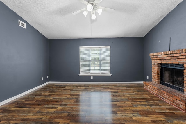 unfurnished living room featuring a fireplace, visible vents, a textured ceiling, and a ceiling fan