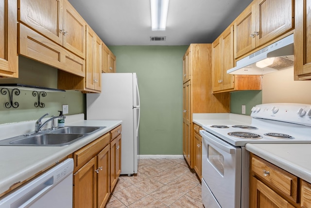 kitchen featuring a sink, visible vents, white appliances, light countertops, and under cabinet range hood