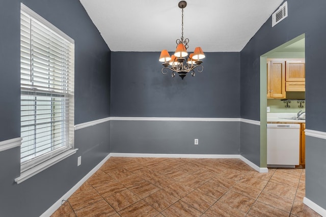 unfurnished room with baseboards, visible vents, and a chandelier