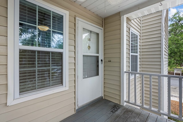 view of exterior entry featuring a porch