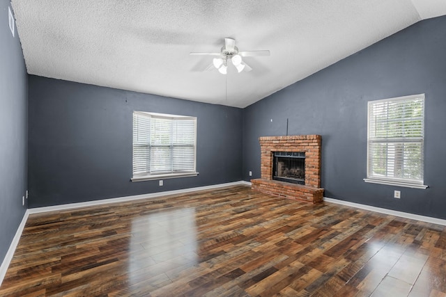unfurnished living room with ceiling fan, lofted ceiling, and a healthy amount of sunlight