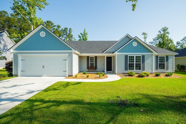 single story home featuring a front lawn, a porch, and a garage