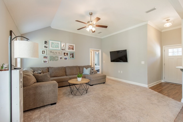 living room featuring ceiling fan, light wood-type flooring, lofted ceiling, and ornamental molding