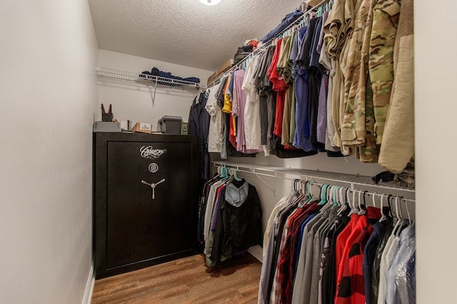 walk in closet featuring light hardwood / wood-style floors