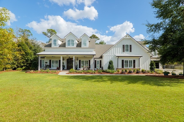 view of front of home featuring covered porch and a front yard