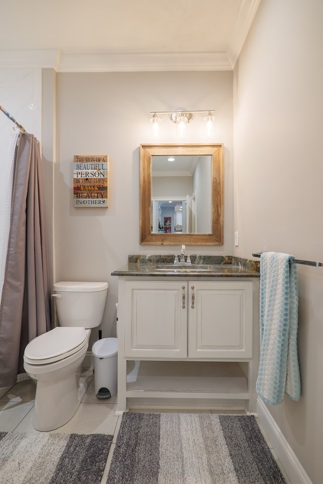 bathroom featuring vanity, toilet, ornamental molding, and walk in shower