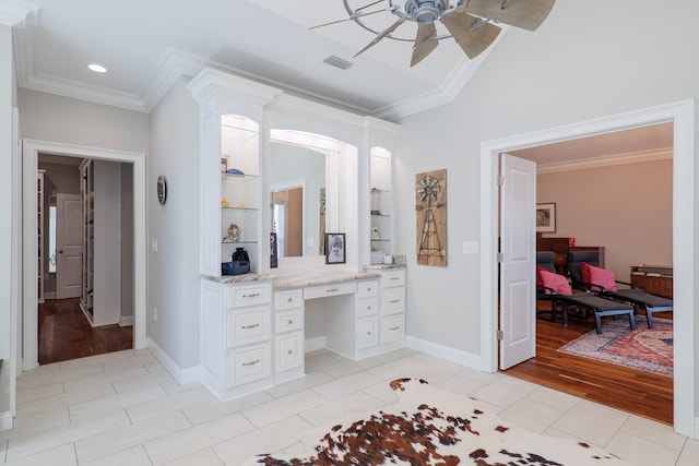 bathroom with hardwood / wood-style floors, built in shelves, crown molding, and vanity