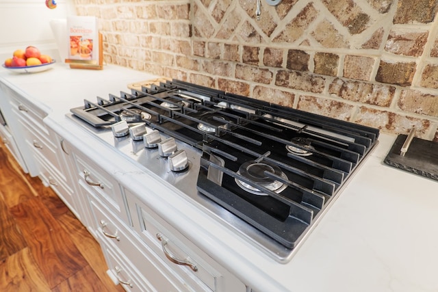 interior details featuring white cabinetry and stainless steel gas cooktop