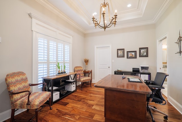 office area featuring a raised ceiling, crown molding, an inviting chandelier, and hardwood / wood-style flooring