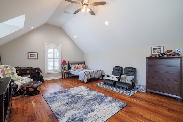 bedroom featuring hardwood / wood-style flooring, ceiling fan, and vaulted ceiling