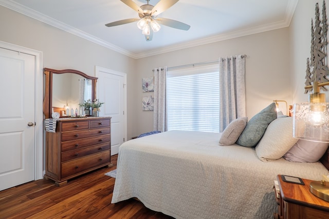 bedroom featuring ceiling fan, dark hardwood / wood-style floors, and ornamental molding