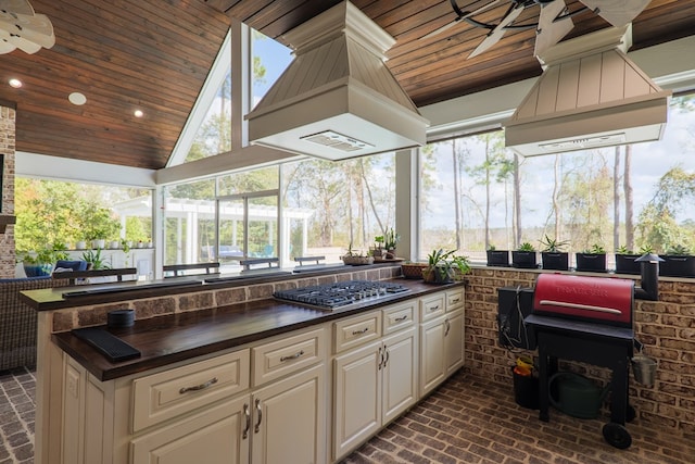 view of patio / terrace featuring ceiling fan and exterior kitchen