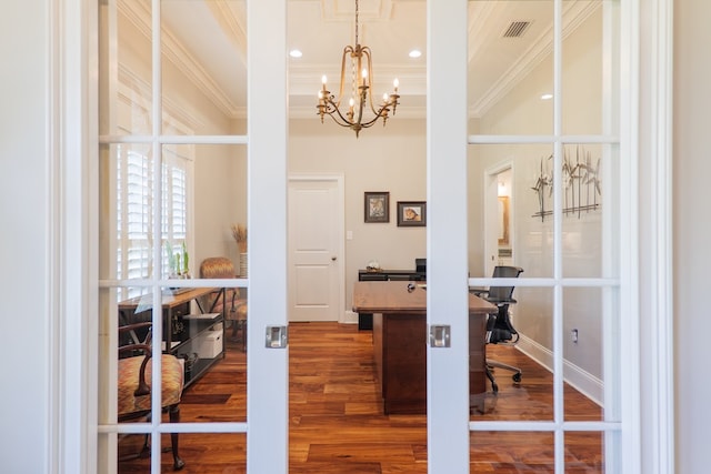 office area featuring an inviting chandelier, ornamental molding, and hardwood / wood-style flooring