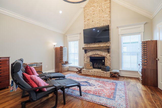 living room featuring a wealth of natural light, wood-type flooring, and ornamental molding