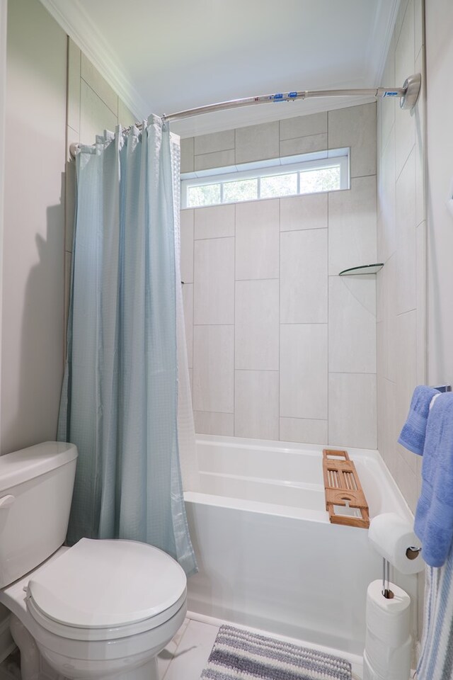 bathroom with tile patterned floors, toilet, shower / bathtub combination with curtain, and crown molding