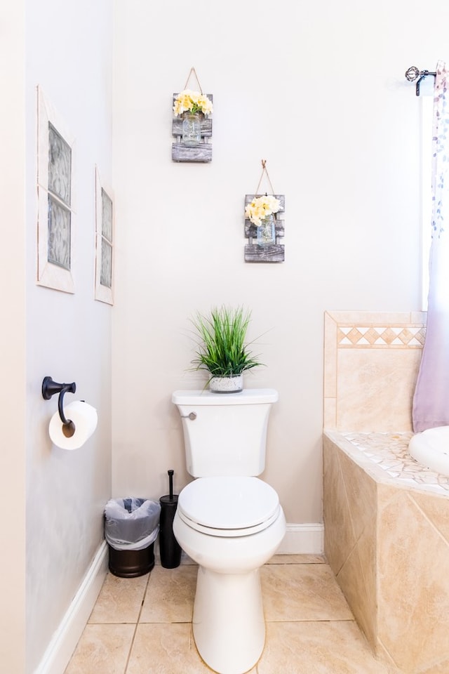 bathroom featuring tile patterned floors and toilet