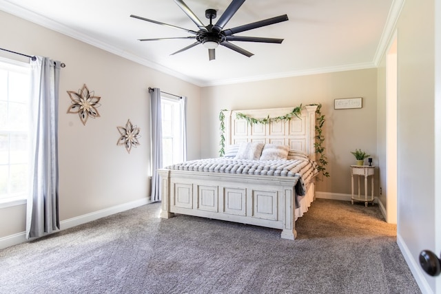 carpeted bedroom with ceiling fan and crown molding